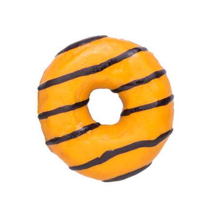 Orange glazed donut isolated on a white background. Delicious popular pastries.の写真素材