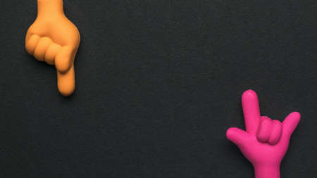 Yellow and red hands with gestures on a black background. Rubber figures of folded fingers.の写真素材