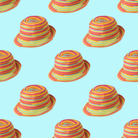 A pattern of colorful summer hats on a blue background. Protective headdress.の写真素材