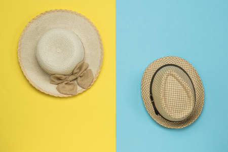 Men's and women's summer hats on a blue and yellow background. Hats.の写真素材