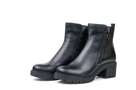 Black leather ankle boots for women made of leather isolated on a white background. Fashionable women's shoes.の写真素材