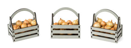 A set of wooden boxes with fresh onions isolated on a white background. Fresh onion harvest.の写真素材