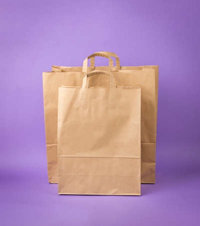 Two large shopping bags on a purple background. Eco-friendly shopping container.の写真素材