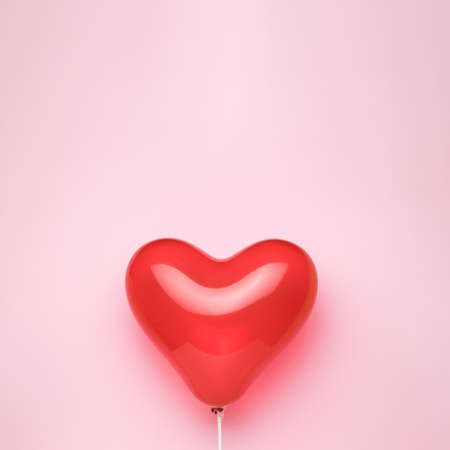 A heart-shaped balloon on a pink background. Space for text. The concept of Valentine's Day.の写真素材