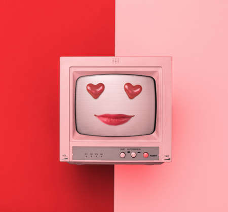 A TV with painted lips and heart-shaped eyes on a red and pink background. The concept of...