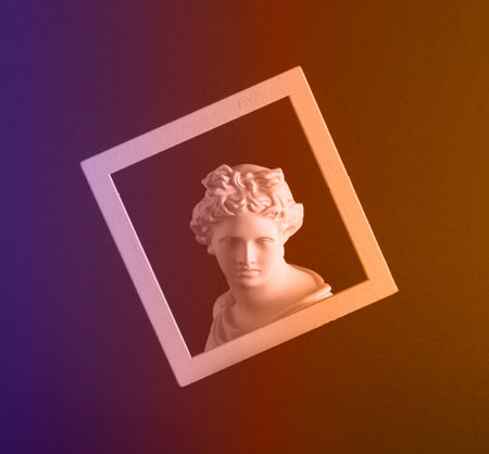 Tinted image of a clay figure in a frame on an abstract background. background.