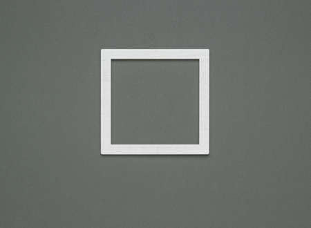 Square white wooden frame on a dark gray background. Template for photos and pictures.