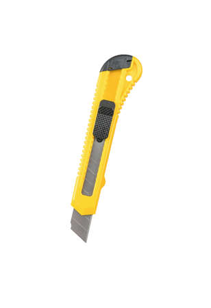 Unfolded yellow stationery knife isolated on a white background. stationery.の写真素材