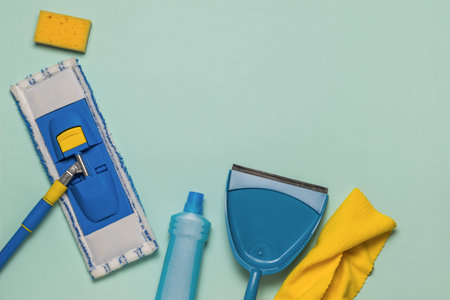 Wet cleaning kit on a light blue background. Space for text. The concept of cleaning the premises. flat lay.の写真素材