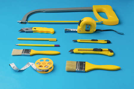 Tools for creativity and repair on a blue background. The concept of repair and construction.の写真素材