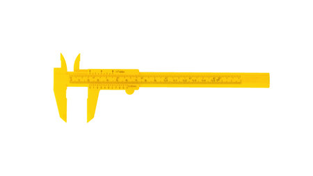 Plastic yellow caliper insulated on a white background. A tool for accurate measurement of dimensions.の写真素材