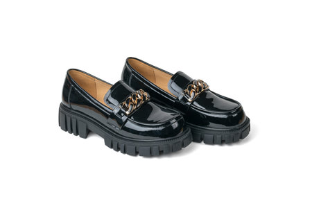Fashionable leather women's boots with a brutal sole isolated on a white background. Fashionable women's shoes.の写真素材