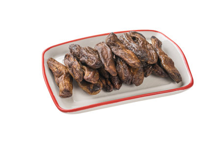 A white plate with dried bananas isolated on a white background. Delicious natural fruit snack.の写真素材