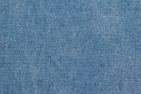 The background is made of light blue denim. A popular material for making clothes.の写真素材