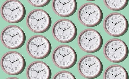 A pattern of a large number of large wall clocks on a light background. Minimal time concept.の写真素材