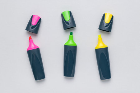 Three markers with removed caps on a white background. The minimum concept of business and education.の写真素材