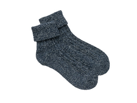A pair of warm socks isolated on a white background. Minimal footwear concept. flat lay.の写真素材