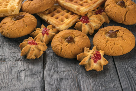 A pile of fresh cookies on a wooden table. Minimal concept of home baking.の写真素材