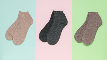 Three pairs of socks on a tricolor background. Casual clothes.の写真素材