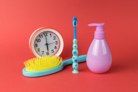 A set of morning supplies on a red background. Accessories for the start of a new day.