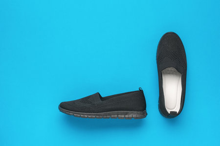 Women's comfortable shoes with white arrows on a blue background. Casual shoes.の写真素材
