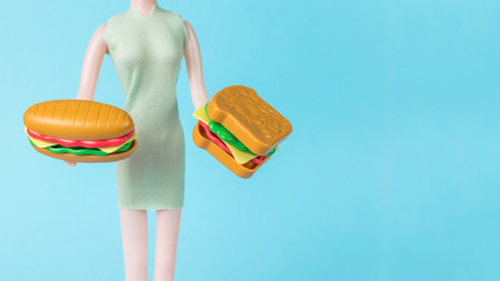 A girl holding a hot dog and a sandwich. The concept of service in a cafe.の写真素材