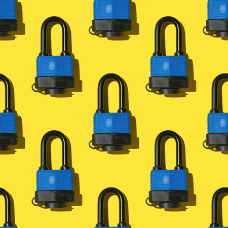 Seamless pattern of closed locks on a yellow background. Devices for the protection of premises.の写真素材