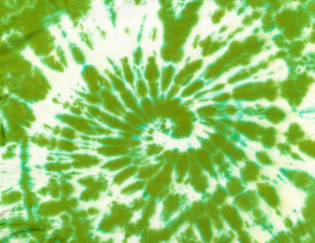 Beautiful green and white tie dye pattern on cotton fabric. The concept of making clothes with your own hands.の写真素材