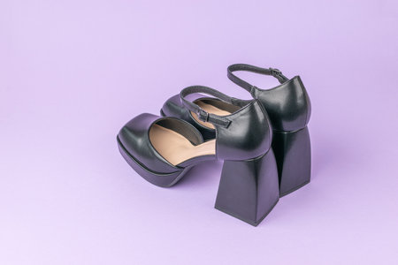 Modern Black Platform Heels on Pastel Purple Backgroundの写真素材