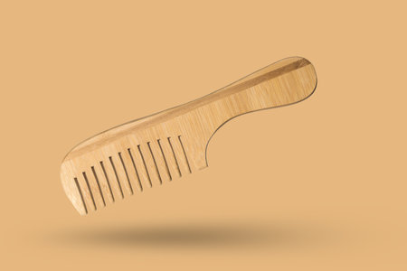 Eco-Friendly Bamboo Comb on Beige Background - Sustainable Hair Care Accessory