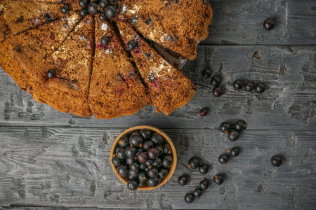 Homemade Blueberry Cake Slices with Fresh Blueberries on Rustic Wooden Backgroundの写真素材