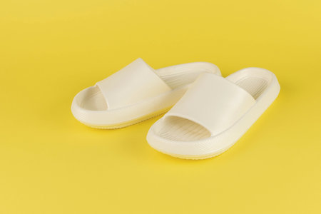 Minimalist White Slides on Bright Yellow Backgroundの写真素材