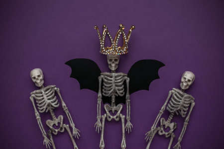 Skeletons in Halloween Costume: Winged Skeleton King with Crown and Purple Backgroundの写真素材