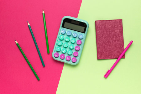 Colorful Calculator and Pencils on Bright Background with Notebook and Penの写真素材