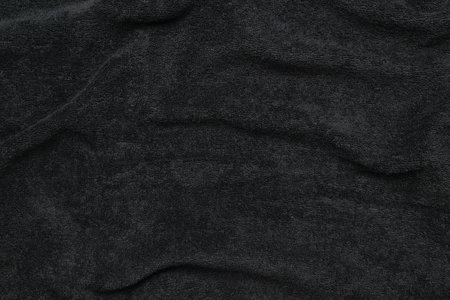 Soft Black Velvet Fabric Texture Close-Up for Elegant Backgrounds and Textilesの写真素材