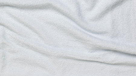 Close-Up of Soft White Fabric with Gentle Folds - Textures and Patterns in Stock Photographyの写真素材