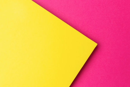 Bright Yellow and Pink Abstract Geometric Background with Vivid Contrasting Colorsの写真素材