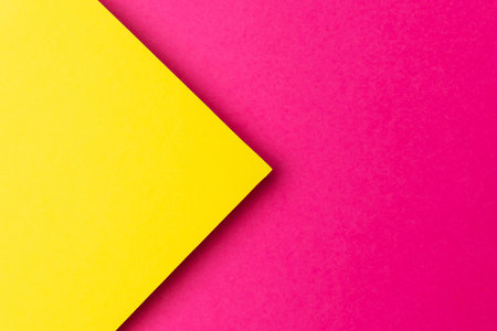 Vibrant Yellow and Pink Geometric Background with Bold Color Contrastの写真素材
