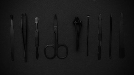 Black Grooming Tools on Dark Background - High Contrast Beauty and Hygiene Accessoriesの写真素材