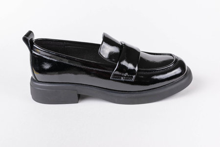 Black Patent Leather Loafer Shoe Isolated on White Background - Stylish Modern Footwearの写真素材