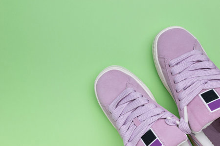 Pastel Purple Sneakers on Green Background - Trendy Fashion Footwear for Active Lifestyleの写真素材