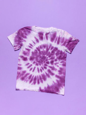 Purple Tie-Dye T-Shirt on Lilac Background - Trendy Fashion Apparelの写真素材
