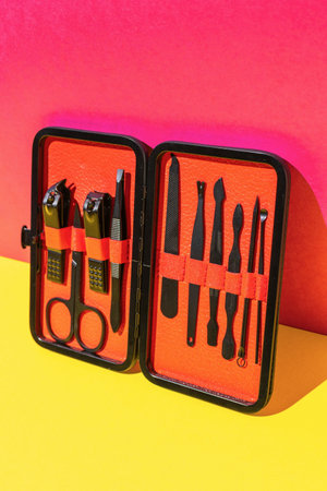 Brightly Colored Manicure and Pedicure Set with Various Tools on Vibrant Backgroundの写真素材