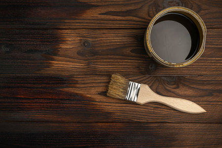 Staining Wooden Surface with Brush and Wood Stain in Tinの写真素材