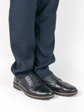 Professional Attire Close-Up: Business Shoes and Suit Pants for Corporate Fashionの写真素材