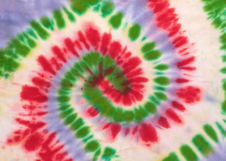 Vibrant Tie-Dye Pattern with Red, Green, and Purple Spiral Designの写真素材