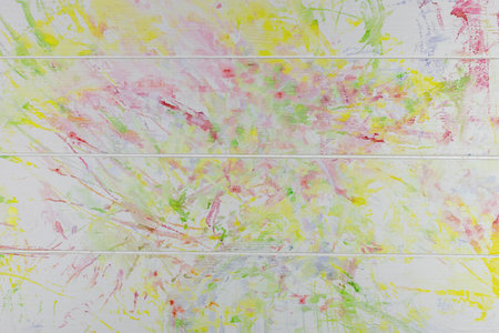 Abstract Colorful Paint Splatter on White Wooden Surface - Vibrant and Artistic Backgroundの写真素材