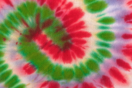 Colorful Tie-Dye Pattern with Vibrant Red, Green, and Purple Spiral Designの写真素材