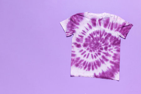 Purple and White Tie-Dye T-Shirt on Lavender Background Trendy Casual Fashion Clothingの写真素材