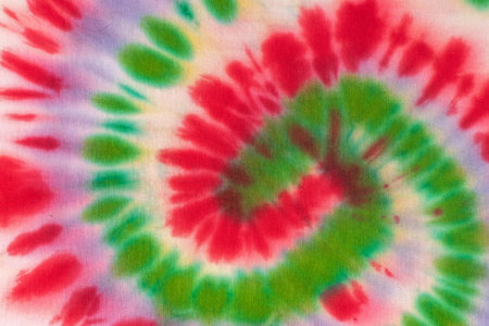 Colorful Tie-Dye Swirl Pattern - Vibrant Red, Green, and Purple Spiral Designの写真素材